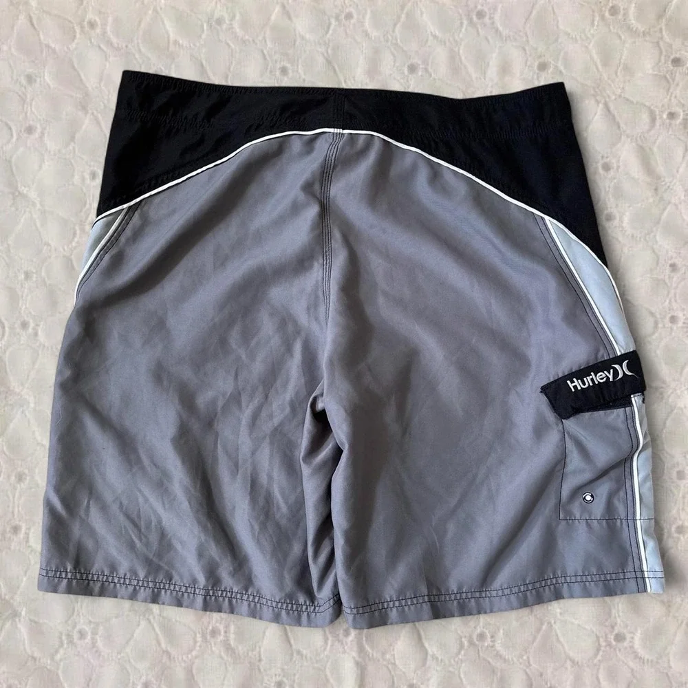 Hurley black and grey board shorts with gray side panels, size 38/XL